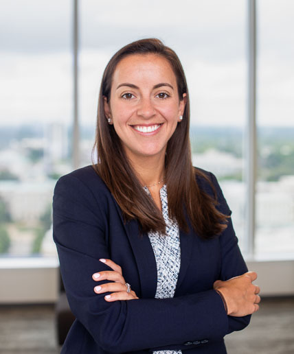 Caroline Margolis, Associate at Poyner Spruill LLP seen in blue color formal office outfit
